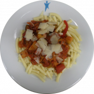 Pasta(81) mit veganer Tomaten-Paprika-Soße(49,81) verfeinert mit Kokosmilch dazu wahlweise gehobelter Parmesan(19) oder vegane Reiberei(1,2)