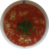 Orientalische Couscous-Tomaten-Suppe mit Knoblauch und Sambal Olek (2,18,49,81) dazu Fladenbrotecke (81,83)