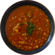 'Deftige Soja - Suppe' mit Sojaschnetzel, Paprikastreifen, Rotwein, Kartoffeln und Knoblauch (1,18,24,44,49,81) dazu Roggenmischbrot (81,82,83)