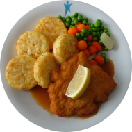 Gebratenes Putenschnitzel mit Zitronenecke (54,81), Geflügelsoße (81) und Möhrengemüse dazu Röstitaler
