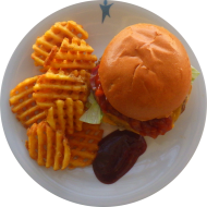 Burger 'Americans Best' mit Bacon, Cheddar und BBQ-Sauce (1,2,3,5,11,19,21,22,24,48,51,52,81,83) dazu CrissCuts