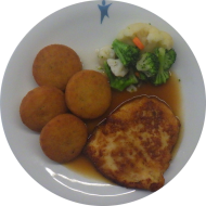 Gebratenes Hähnchenbrustfilet in Honig-Thymian-Marinade (48) an Geflügelsoße (81) dazu feine Gemüsemischung mit Macaire Kartoffeln (81)