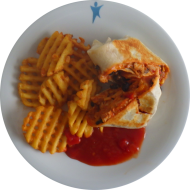 Mexikanischer Burrito mit Pute, Cheddar, Bohnen, Mais und Chilisauce (1,19,54,81) dazu Gitterkartoffeln (81)