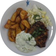 Schweinerückensteak 'Vindaloo' mit Joghurt-Gurken-Raita (1,19,24,48,49,51) dazu Currykartoffeln und Salatgarnitur
