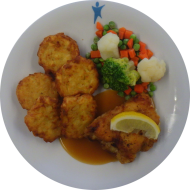 Hähnchenfilet 'Cordon bleu' mit Zitronenecke (2,8,19,54,81) an Geflügelsoße (54,81) mit feiner Gemüsemischung und Rustico Taler 