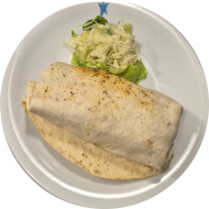 Cheeseburger Burrito mit Rindfleischpatty, Käse. Reis, Mais und hausgemachter Burgersauce gefüllt (1,2,9,19,22,52,81) 