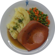 Gebratener Leberkäse (1,2,3,8,21,22,51,63) mit Zwiebelsoße (81) und Mischgemüse dazu Buttermilch-Kartoffelstampf (19,62)
