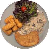 Schnitzelabend: Gemüseschnitzel mit Zitronenecke (81) mit Rahmchampignons (1,3,19,24,81) dazu Kroketten (81)