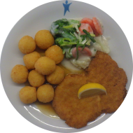 Marienfelder Schweineschnitzel mit Zitronenecke (15,81) an Bratenjus dazu buntes Rahmgemüse (19,81) und Kartoffelbällchen (81)