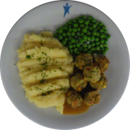 7 Gemüse-Köttbullar (15) an Bratenrahmsoße (19,81) dazu Erbsengemüse und hausgemachtes Kartoffelpüree (19)