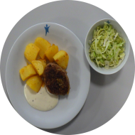 Hausgemachte Geflügelbulette (23,49,81) mit Limetten-Majonnaise (1,19) dazu Ofenkartoffeln mit mediterranen Kräutern und Spitzkohlsalat mit Sesam (23)