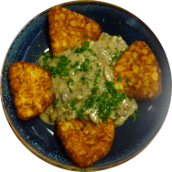 Rahmchampignons mit frischer Petersilie (18) dazu 4 gebackene Kartoffelröstiecken 