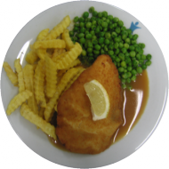 Schweineschnitzel mit Zitronenkeil (81) dazu Pommes frites und Kaisergemüse