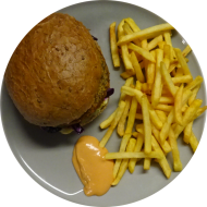 Burger Kürbis-Chia mit Eisberg, Rotkohl-Slaw und House-Dip (9,22,81) dazu als Menüoption Pommes und House-Dip (9,22)