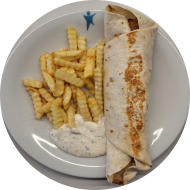 Dürüm gefüllt mit Hähnchenkebab, Tomate, Gurke, Hirtenkäse, Kraut und Kräutersoße (15,19,49,81) dazu Pommes frites