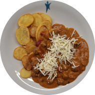 Sonneblumengyros in Metaxasoße mit Zwiebel, Paprika und Knoblauch (1,18,49,84) dazu gebackene Knoblauchkartoffeln (49)