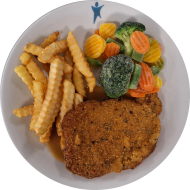 Schweineschnitzel 'Toscana' in würziger Kräuterpanade (15,81) und Bratenrahmsoße (19,81) mit feiner Gemüsemischung dazu Pommes frites