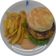 'Big Kahuna Burger' mit Rindfleischpatty, Cheddar, gegrillter Ananas und geschmorten Zwiebeln (1,2,9,15,18,19,22,81) dazu Rustico Frites 