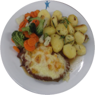 Schweinerückensteak mit Spargelragout und Käse überbacken (19,81) dazu würzige Schwenkkartoffeln
