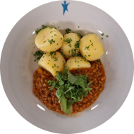Grünkernragout mit Tomate und Rucola (49,81,85) dazu Petersilienkartoffeln