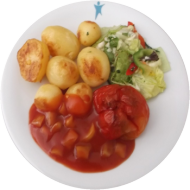 Vegan: Gefüllte rote Paprikaschote (21,22) mit Texicana-Salsa-Dip (9) dazu würzige Schwenkkartoffeln und Gurkensalat