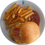 'Americans Best' Burger mit Bacon, Tomate, Cheddar und BBQ-Sauce (1,2,3,5,11,19,21,22,24,48,51,52,81) mit Mayonnaise-Kräuter-Dip (3,9,15,19,21,81) dazu Rustico Frites