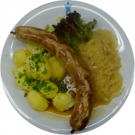 Thüringer Riesenroster mit würziger Bratenjus und deftigem Sauerkraut dazu Zwiebel-Kartoffelpüree (3,4,19,21,22,51,52,81)